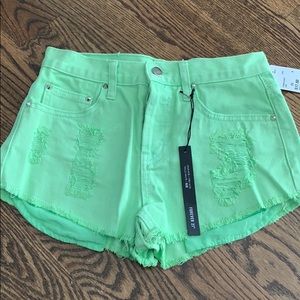 Neon high rise distressed cut off shorts